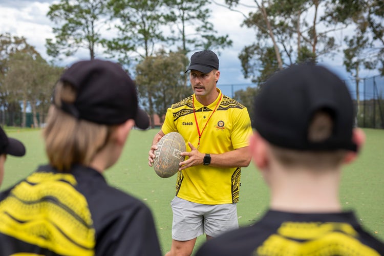 teacher presenting sports program and students listening