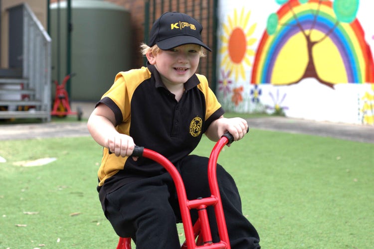 student on trike outdoors