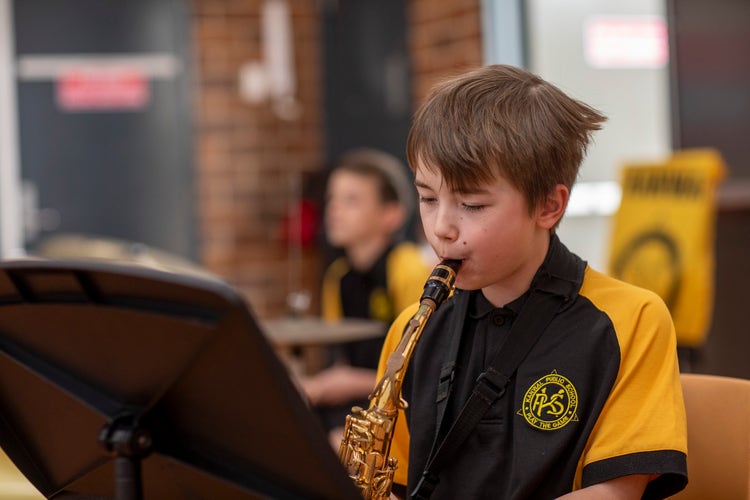 student playing instrument