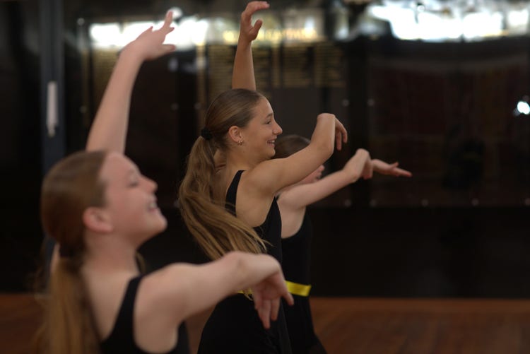 three girls dancing
